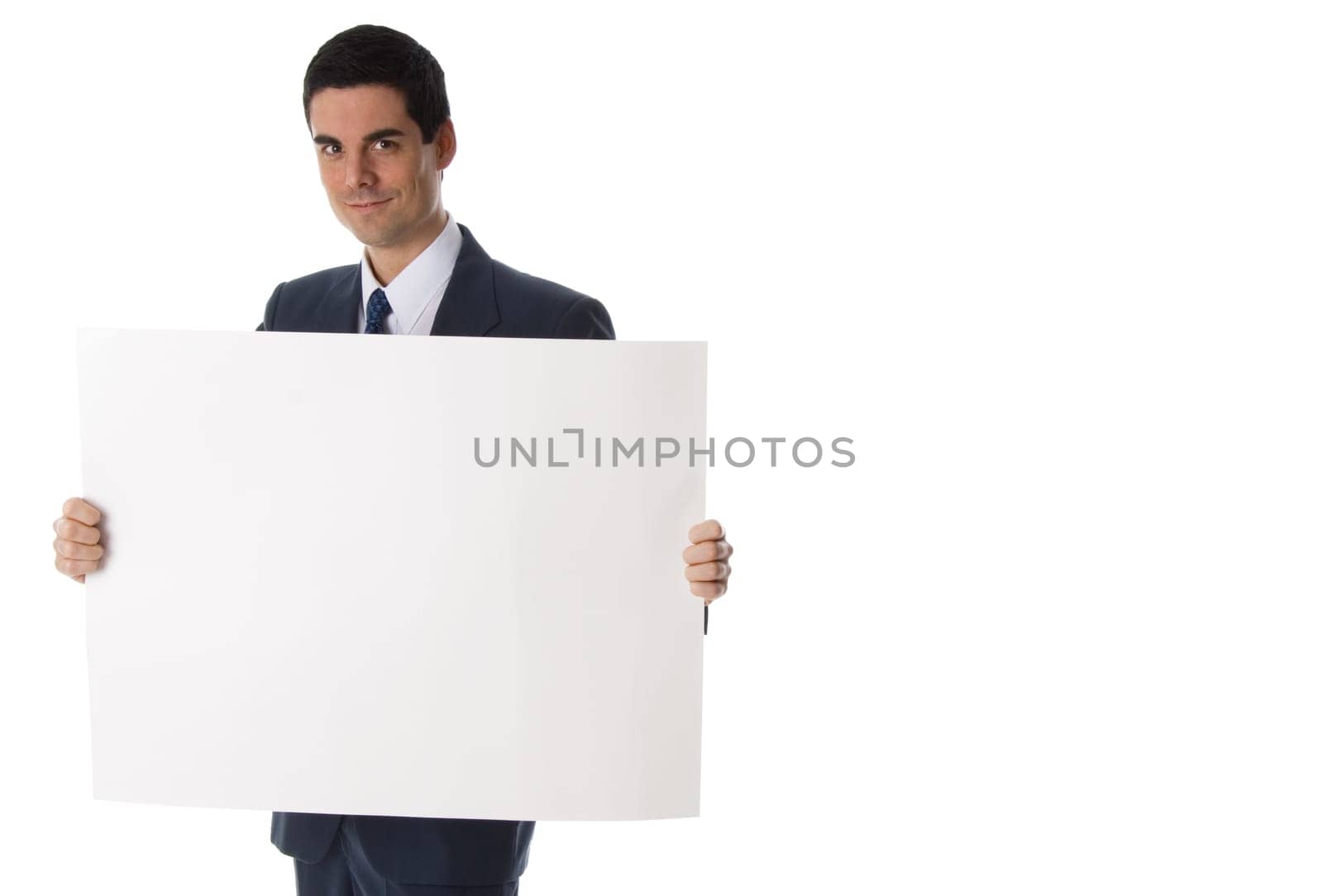 businessman in blue suit holding a white card