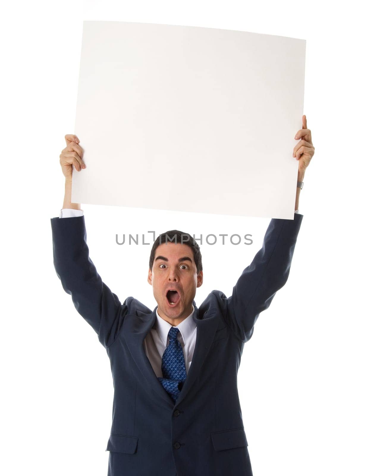 man in blue suit holing a card above his head