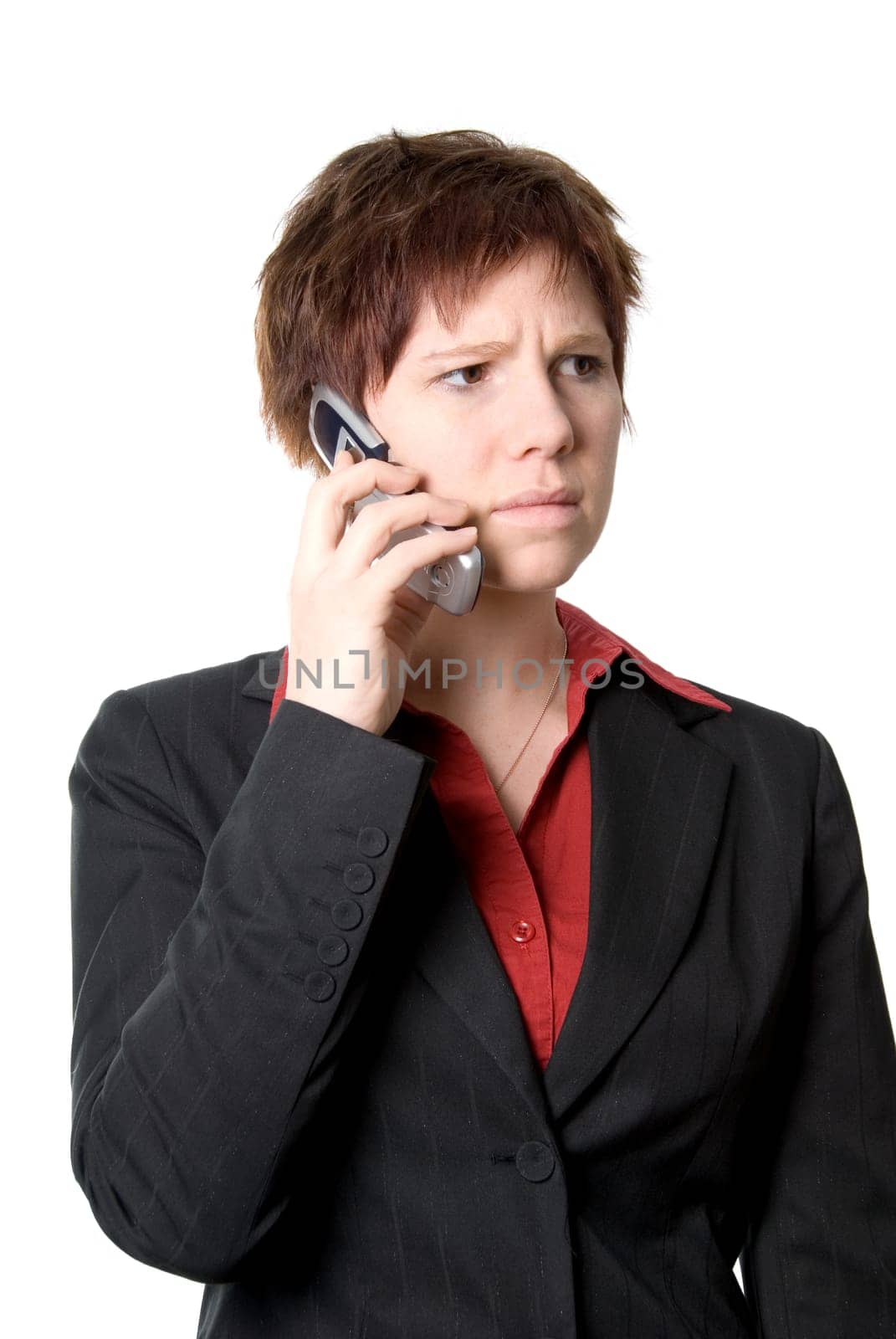 annoyed woman in black jacket on the cell phone