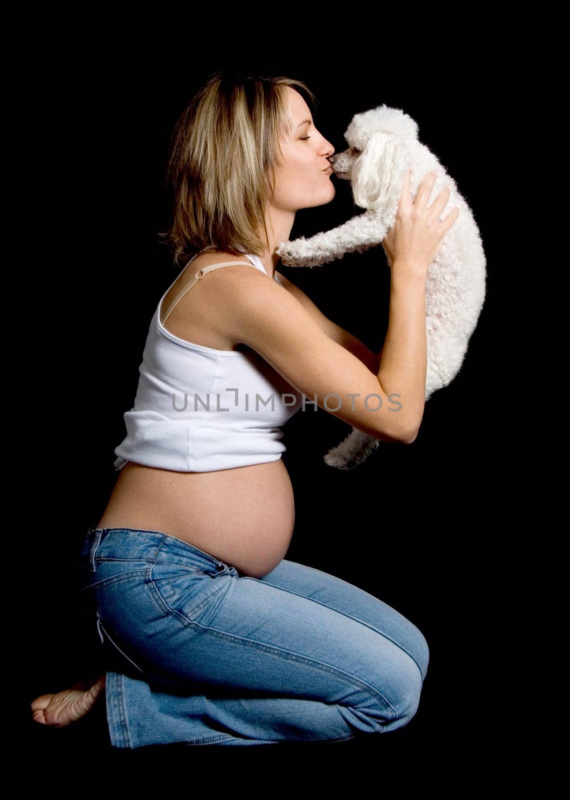 future mother with her pet poodle dog