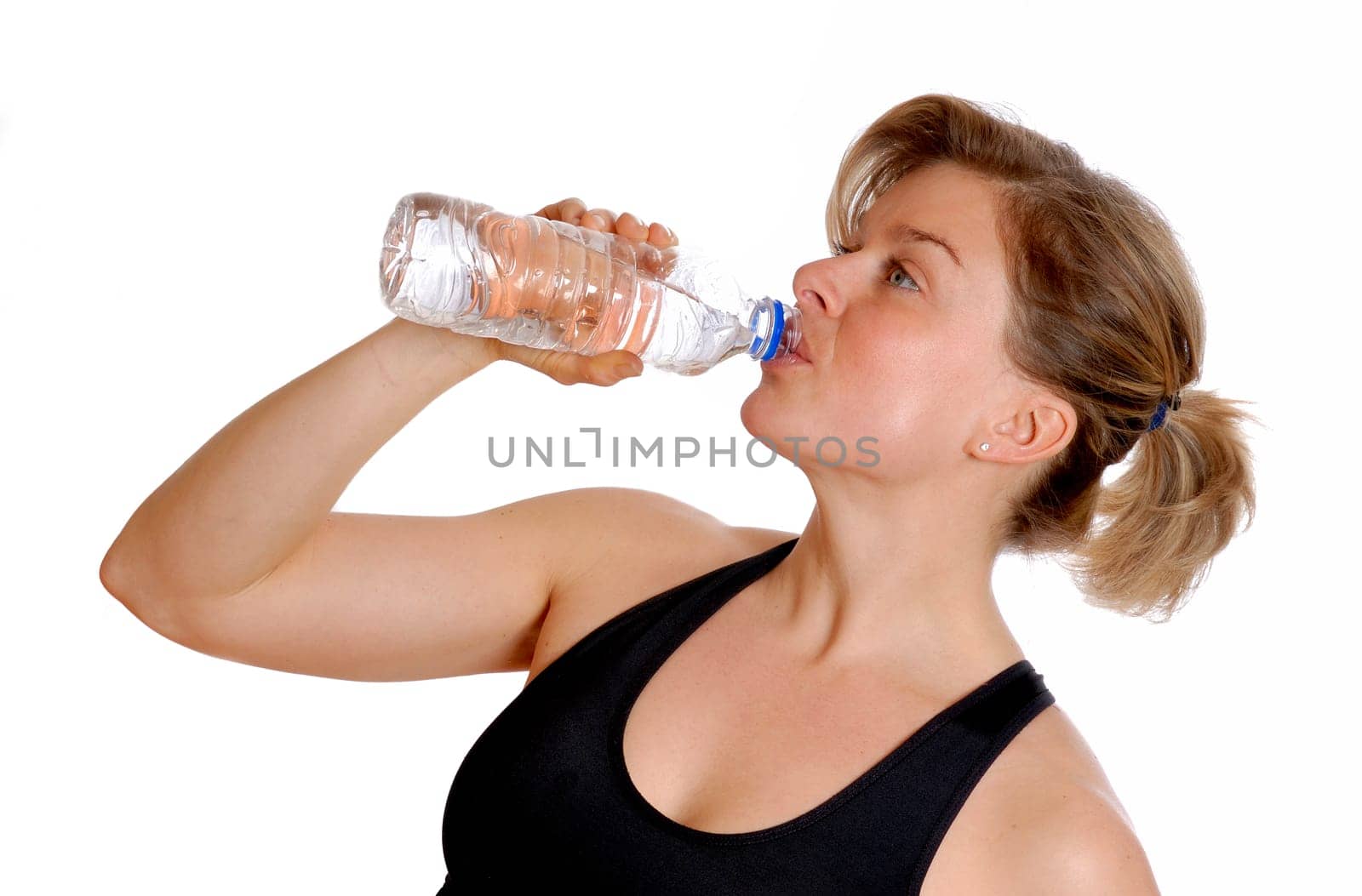 cute blond woman drinking from a bottle