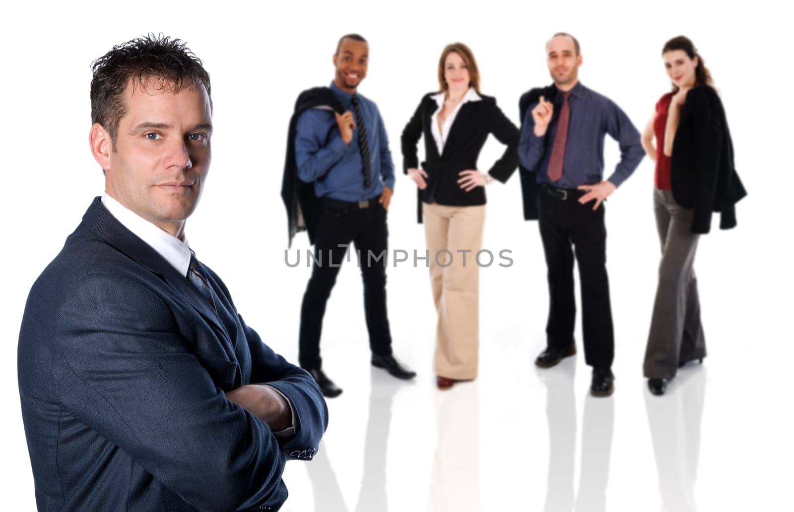 businessman in a blue suit with arms crossed