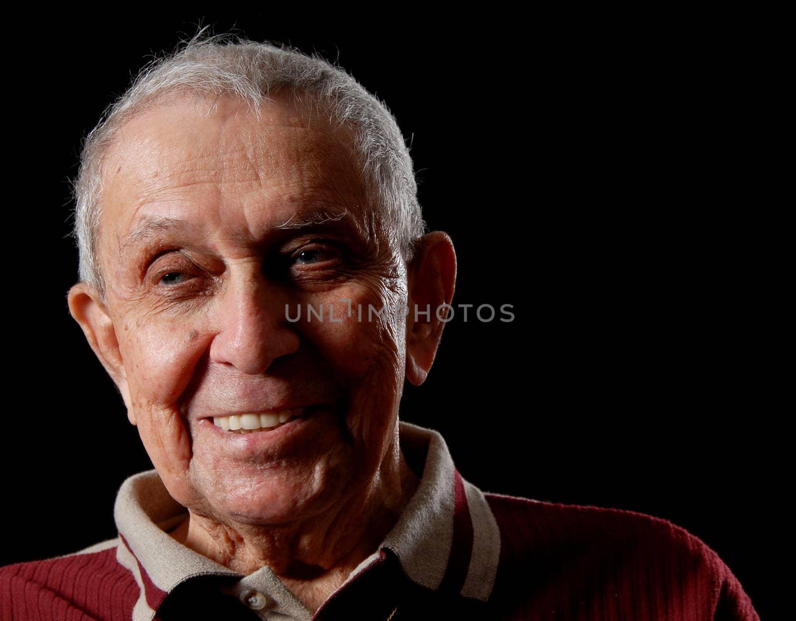 elderly grandfather on a black isolated background