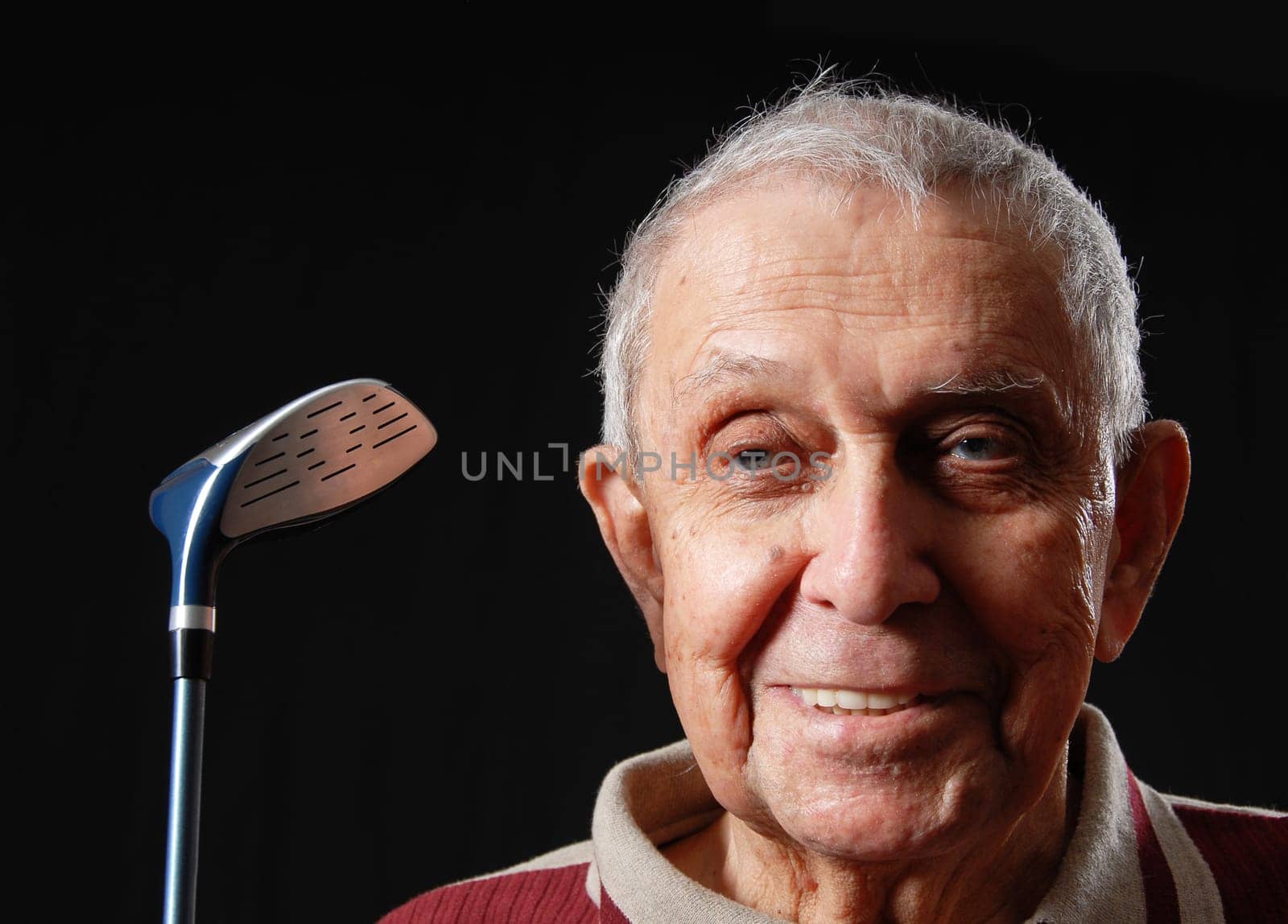 happy grandfather with his gold club smiling