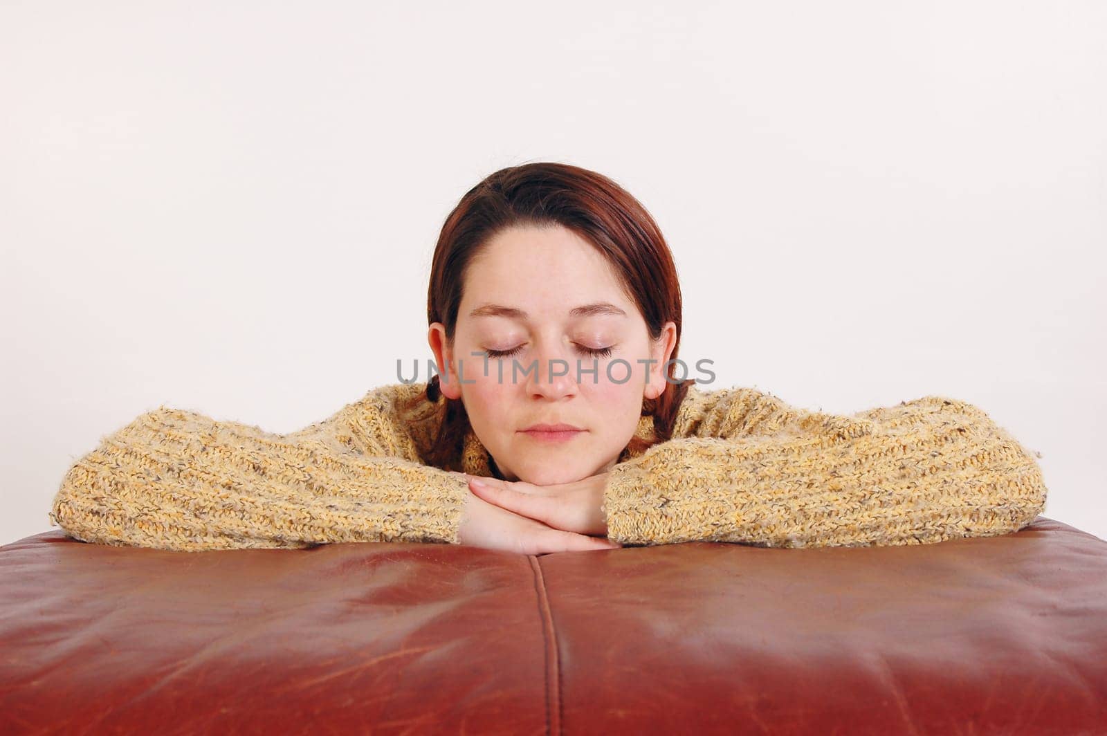 young woman relaxing with her eyes closed