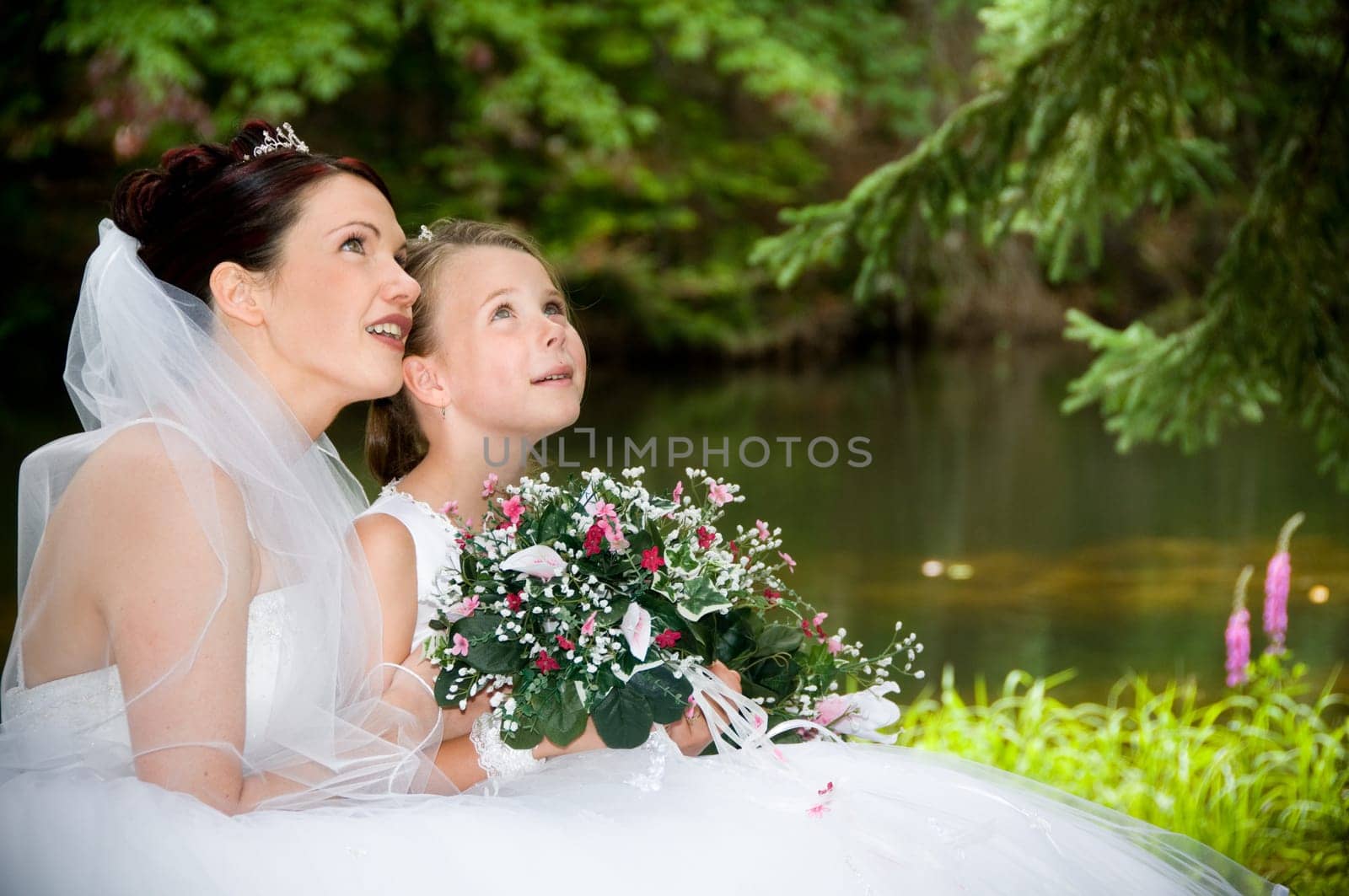 White Bride at her wedding posing with veil
