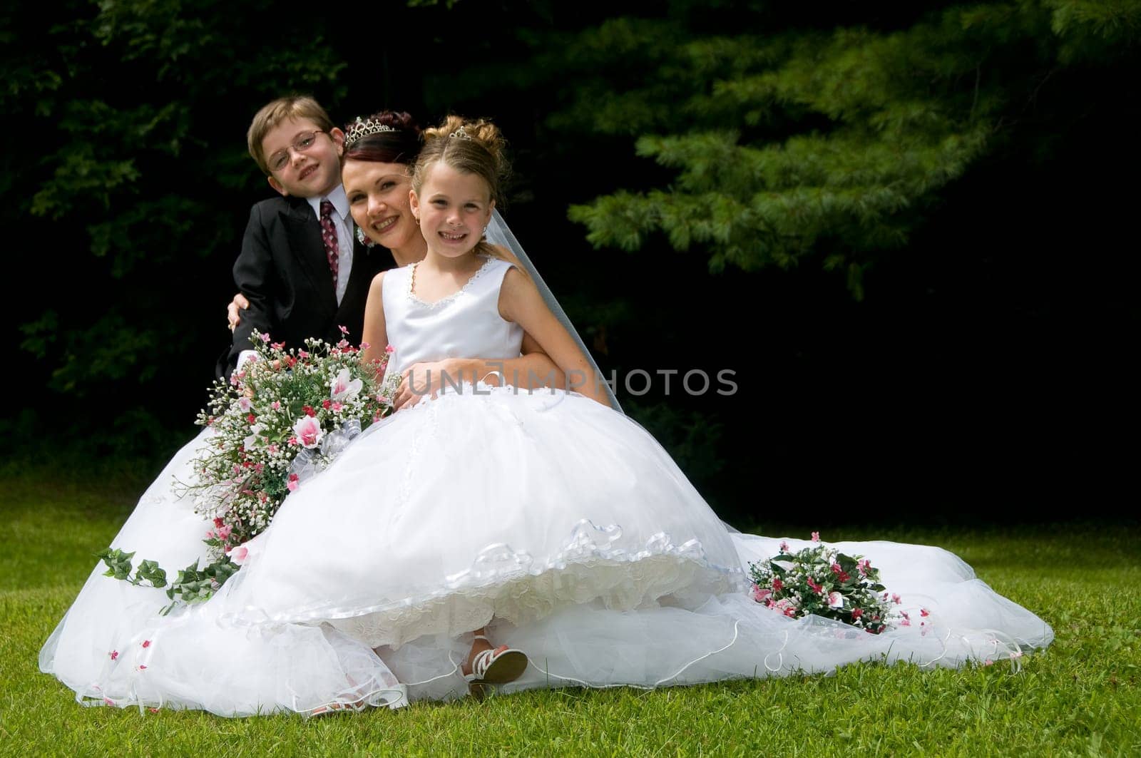 White Bride at her wedding posing with veil