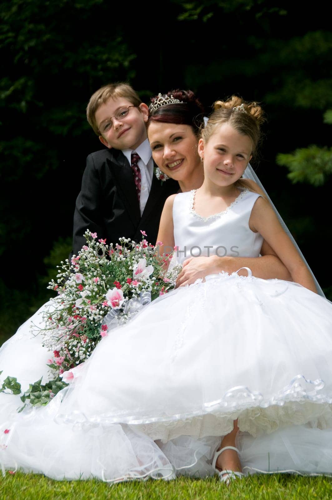 White Bride at her wedding posing with veil