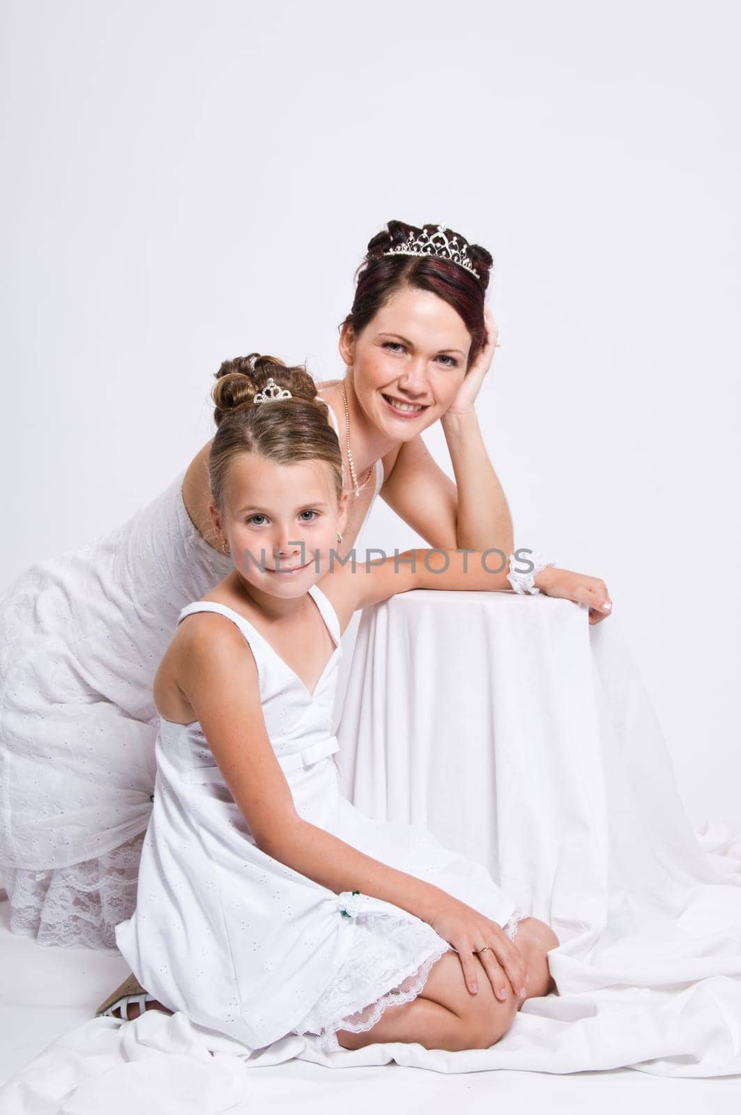 White Bride at her wedding posing with veil
