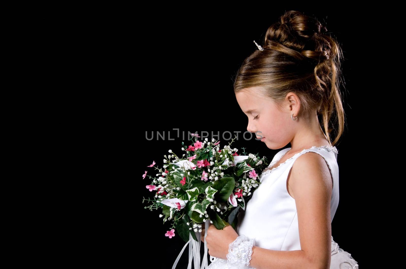 White Bride at her wedding posing with veil