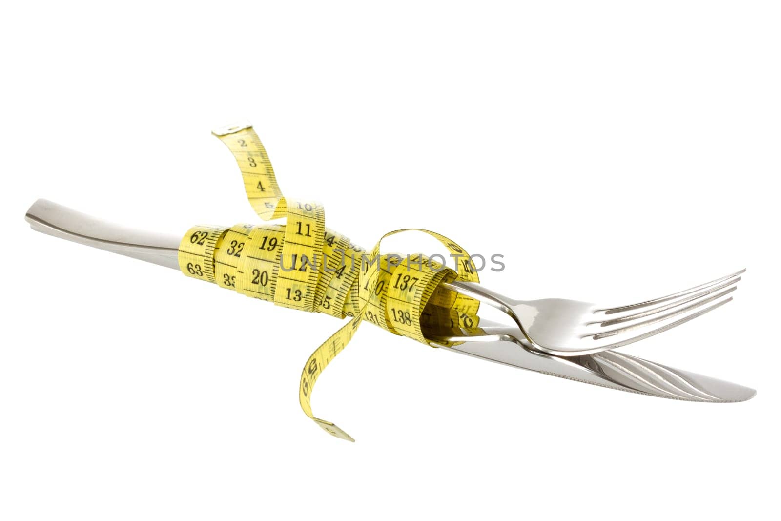 Fork and knife wrapped by measure tape. Isolated on white background