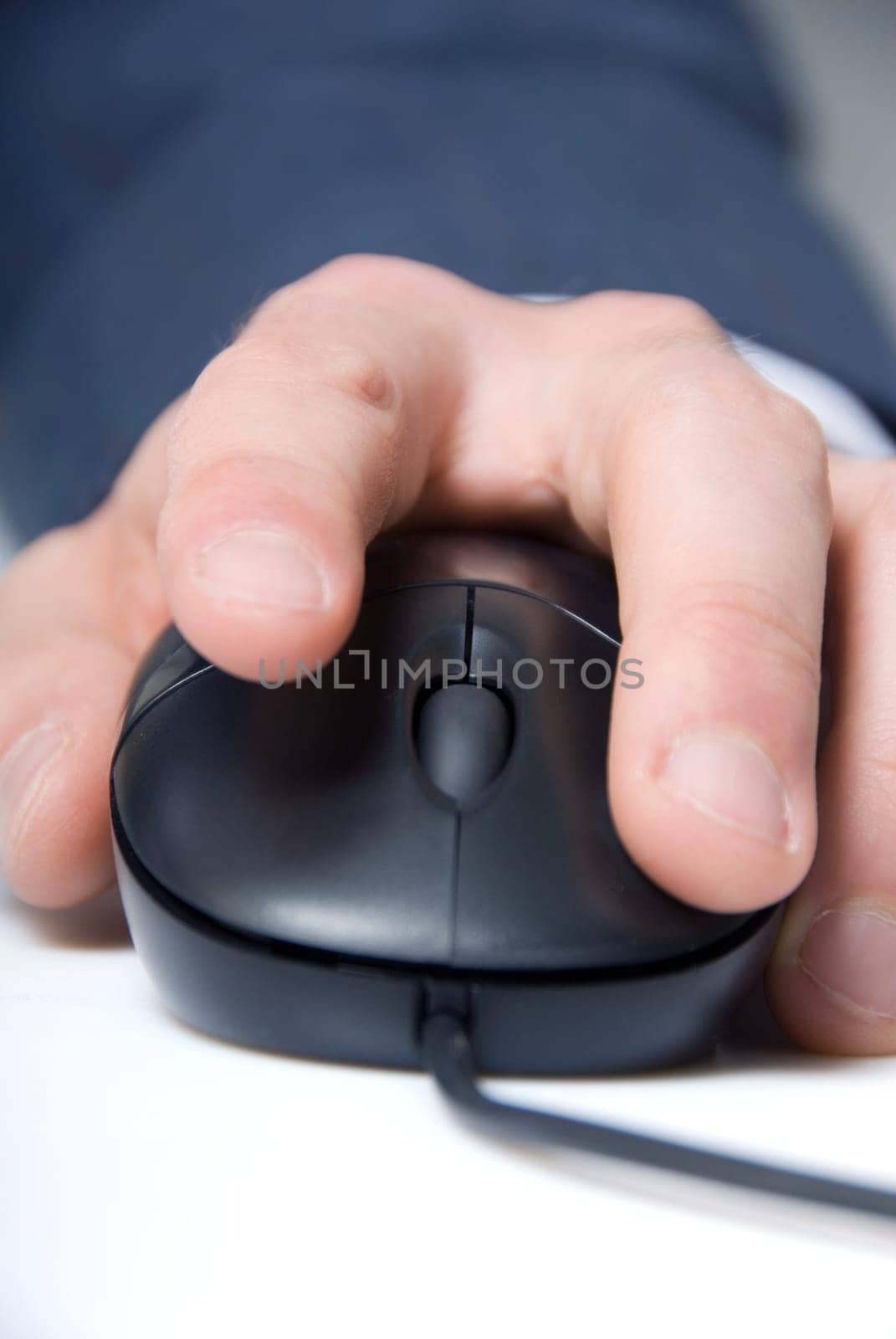 man's hand on a computer mouse