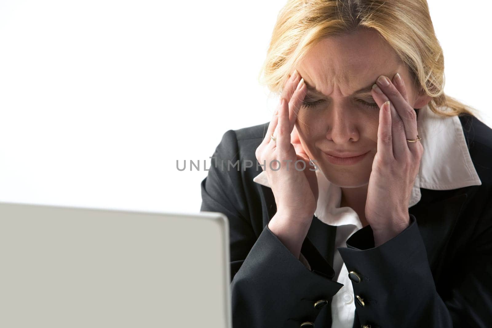 Photo of frustrated businesswoman touching her head in suffer