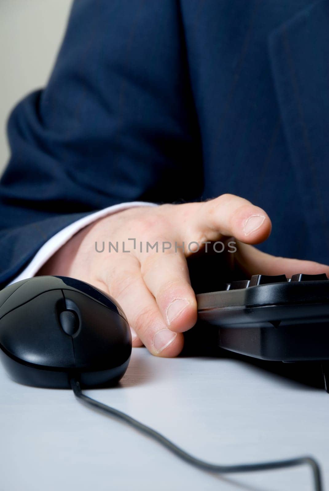 businessman cruching number on keypad