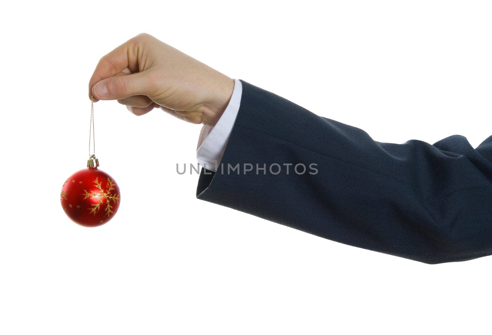 male hand holding a red x-mas ornament