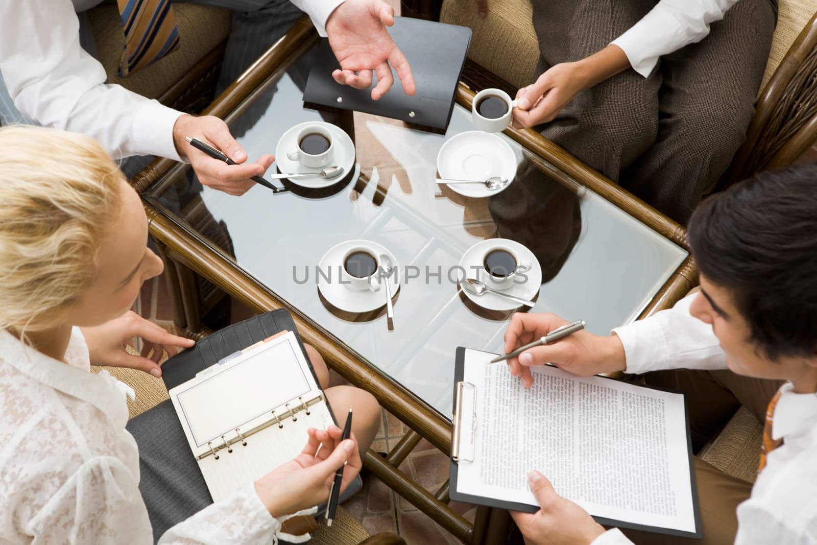 Above view of confident businesspeople planning work in the room