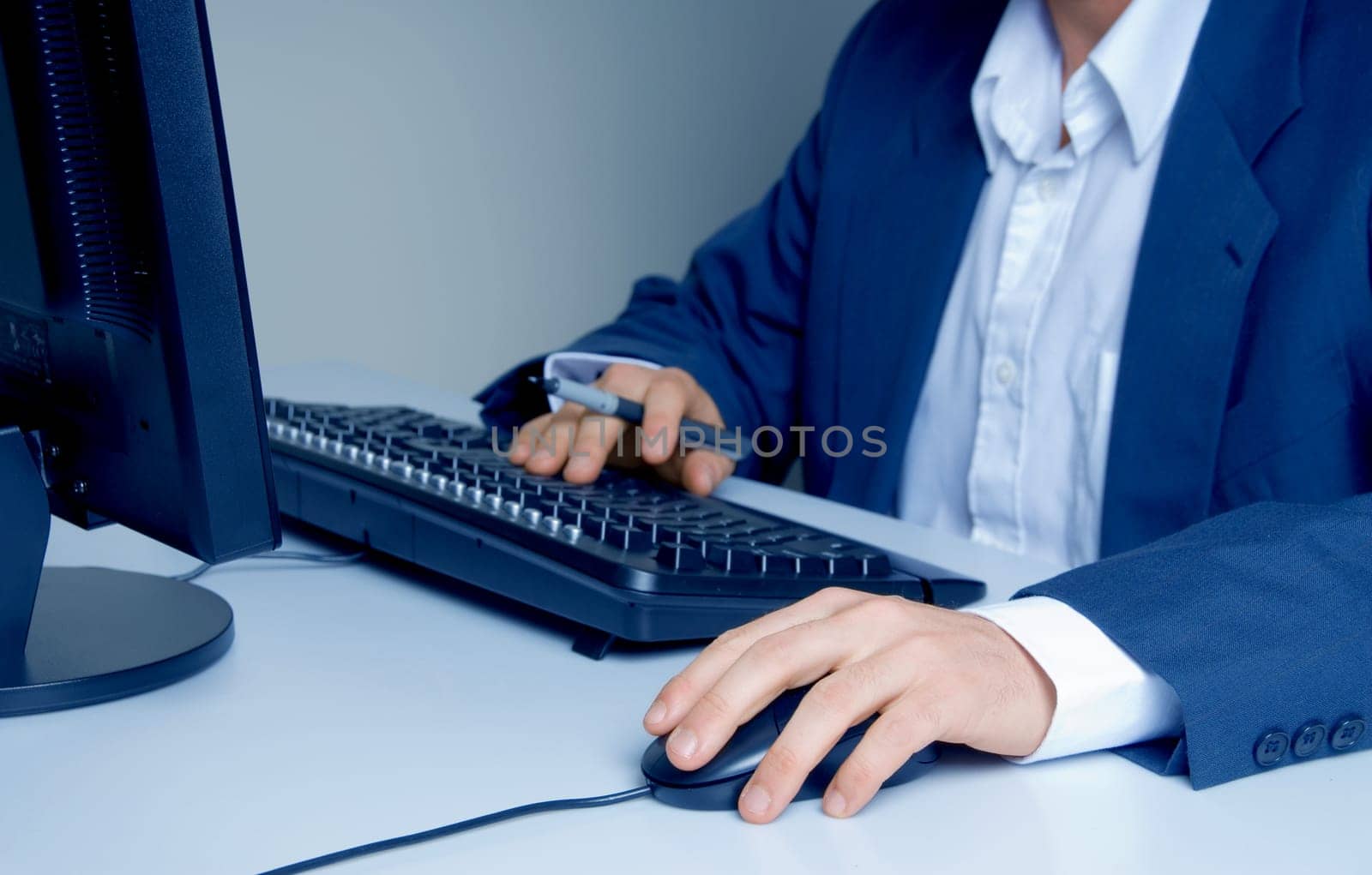 man with pen searching the internet