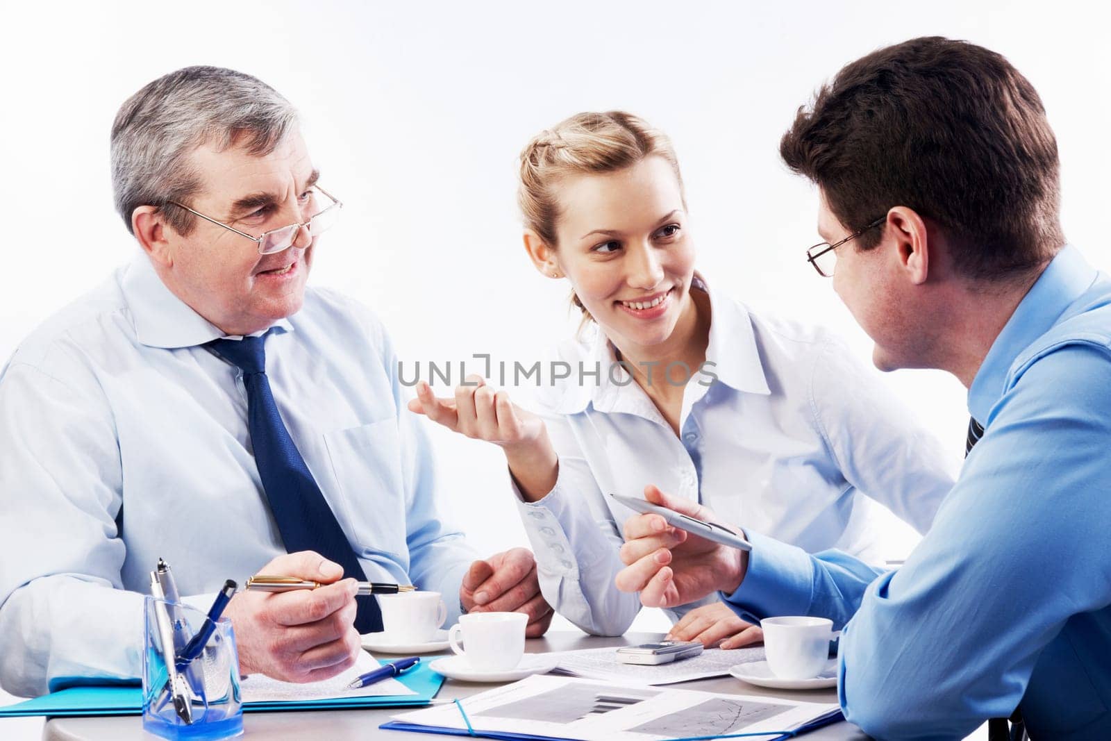 Portrait of three businesspersons brainstorming during coffee break