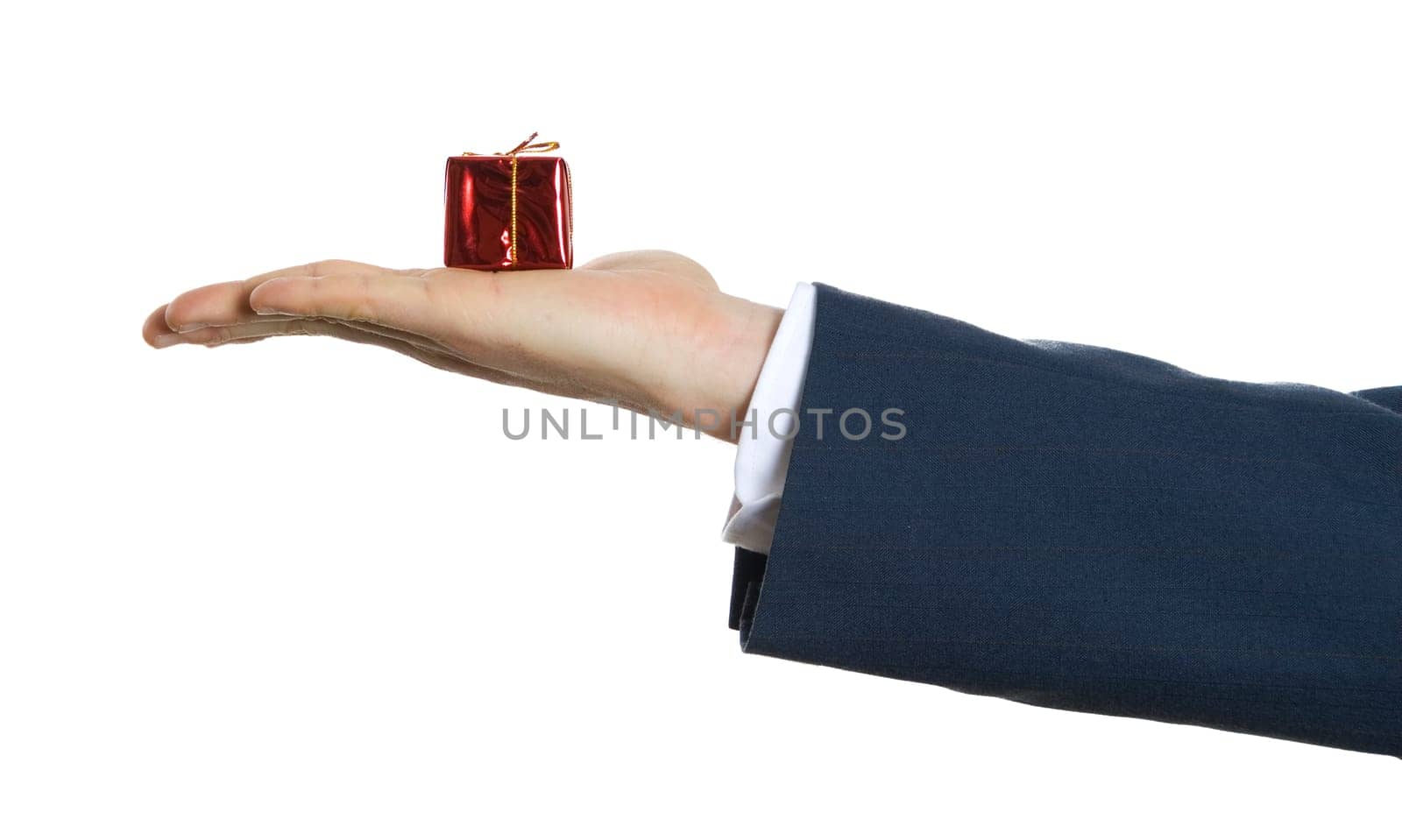 hand in blue suit holding x-mas gift