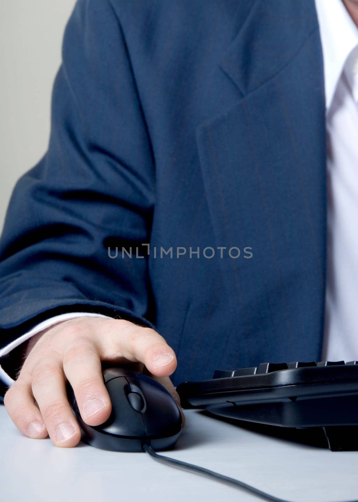 businessman with hand on mouse