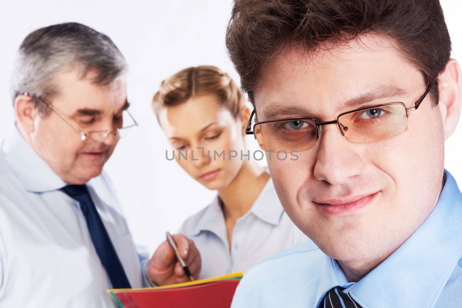 Face of handsome businessman wearing glasses looking at camera