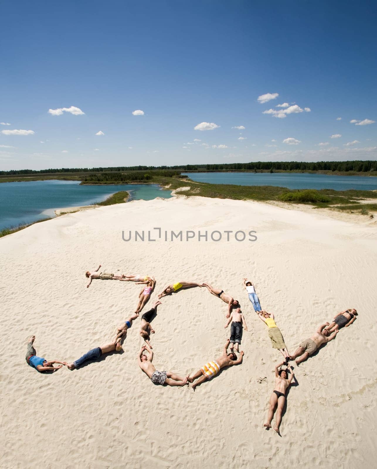 Image of word joy made up of young people sunbathing with sea and sky at background