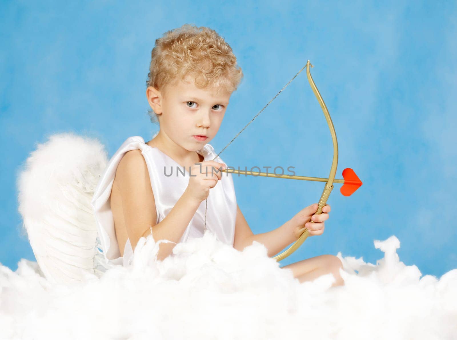 Portrait of little male cupid with bow