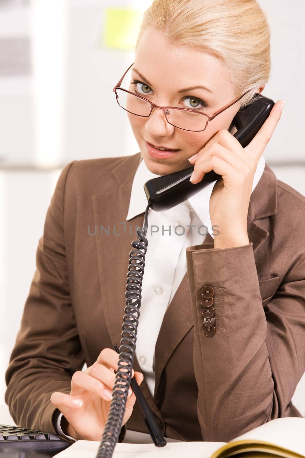 Portrait of smart agent speaking by telephone