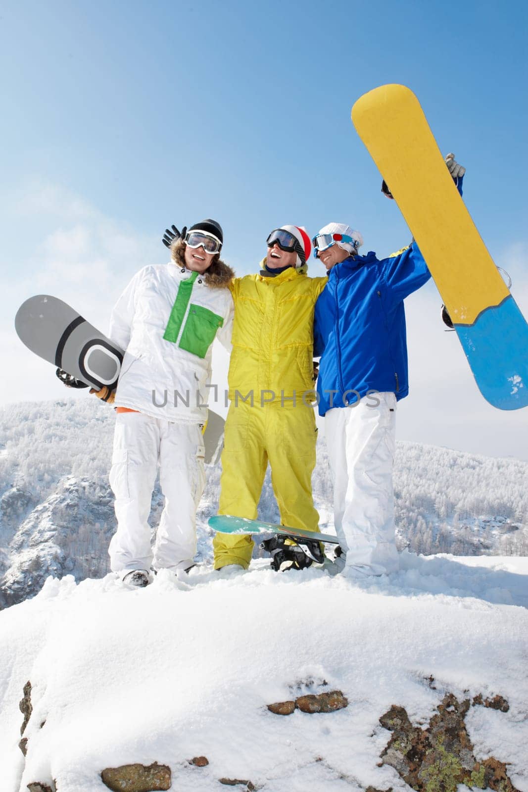 Portrait of three sportsmen standing on the mountain