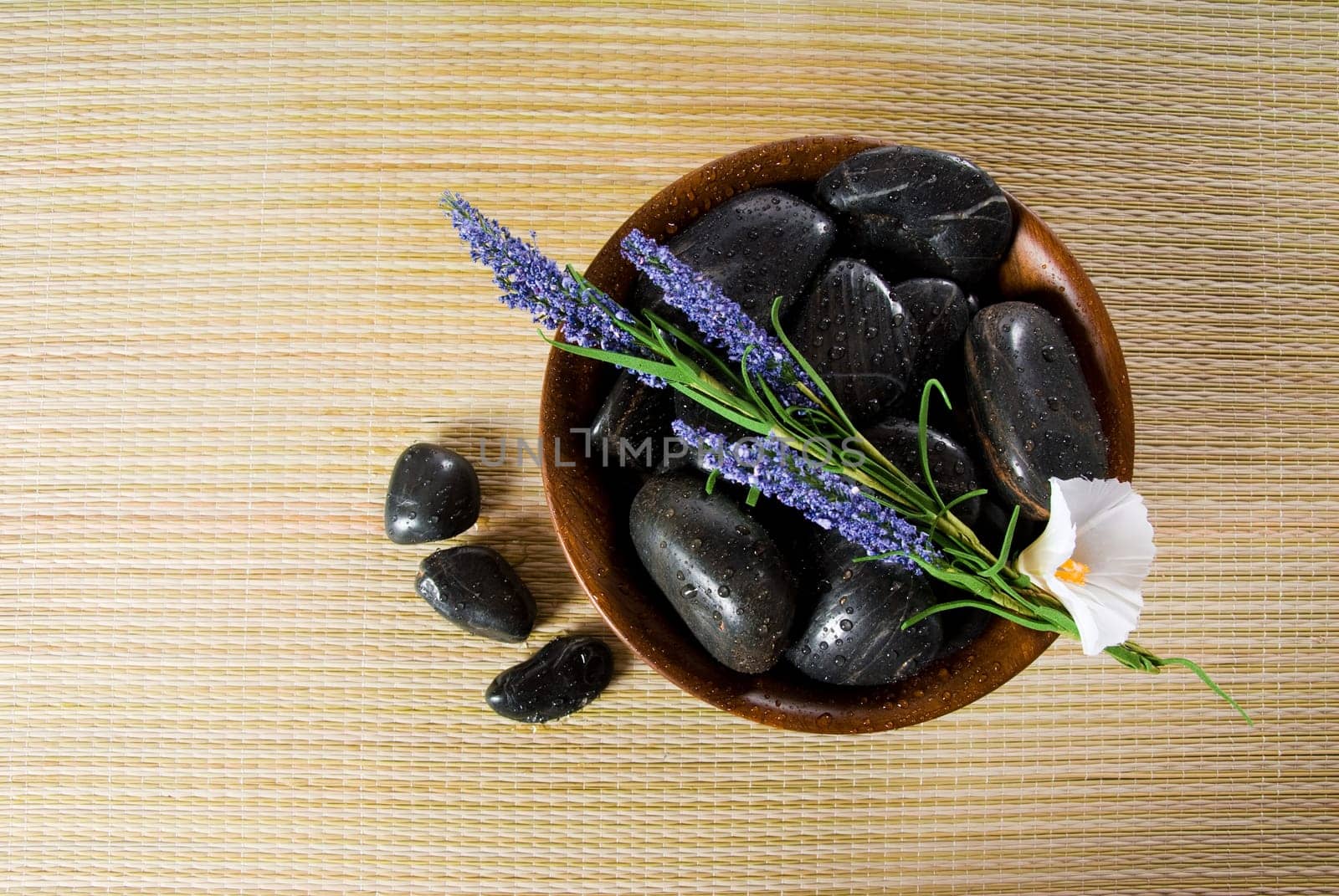 bowl of hot stones for lastone massage