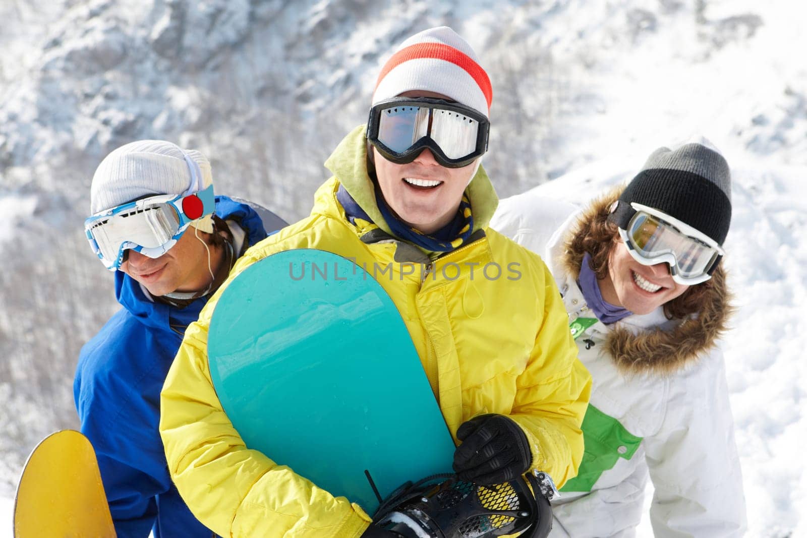 Portrait of three happy friends in googles