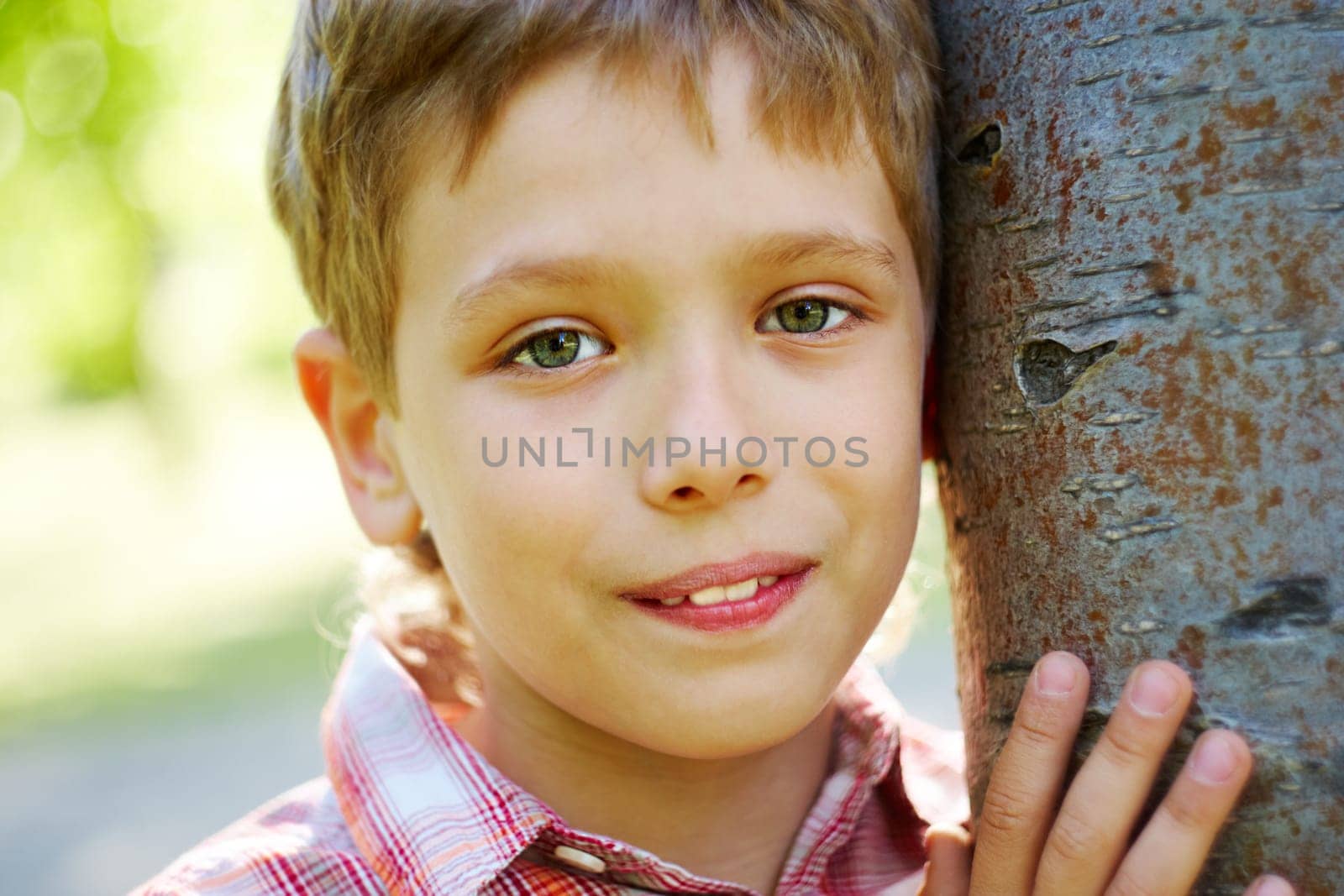 Portrait of handsome schoolboy smiling at camera