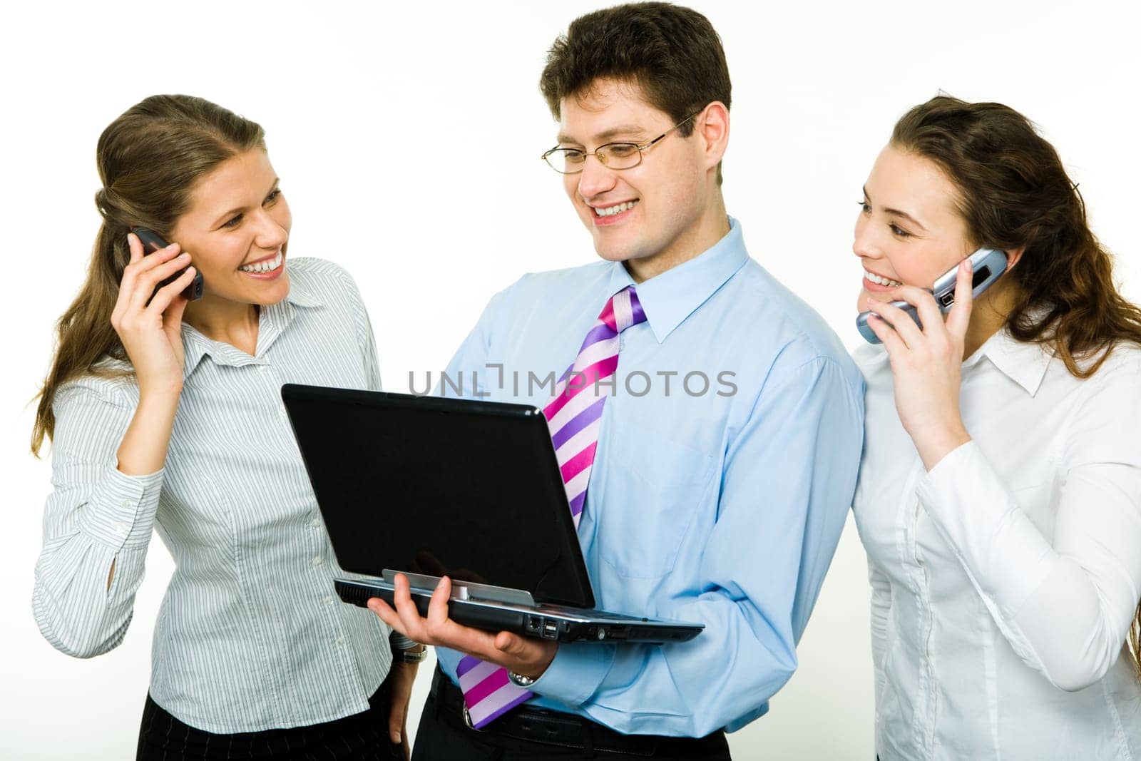 Photo of two women calling by phone with business man between them