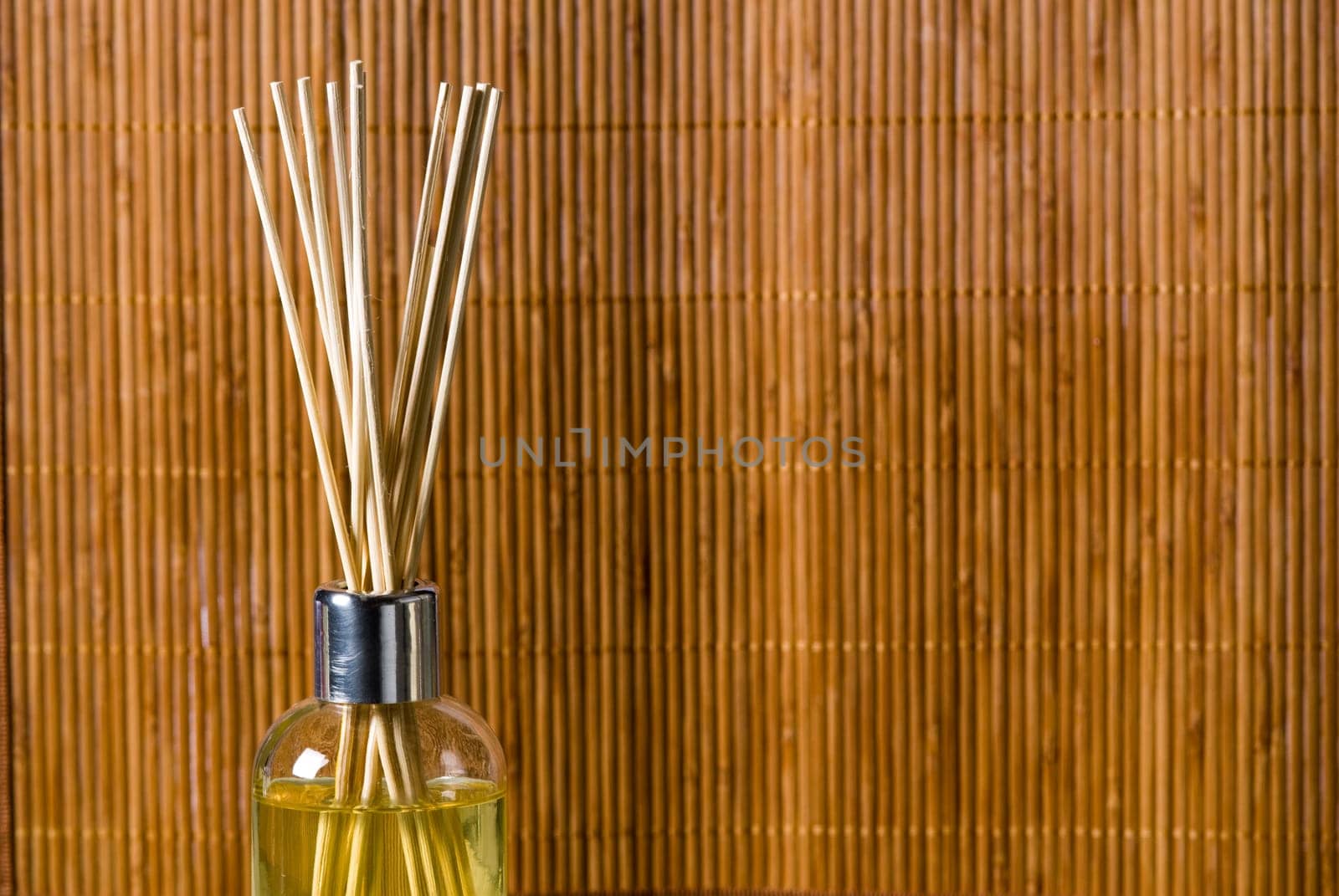 aroma sticks dipped in scented oils on bamboo background