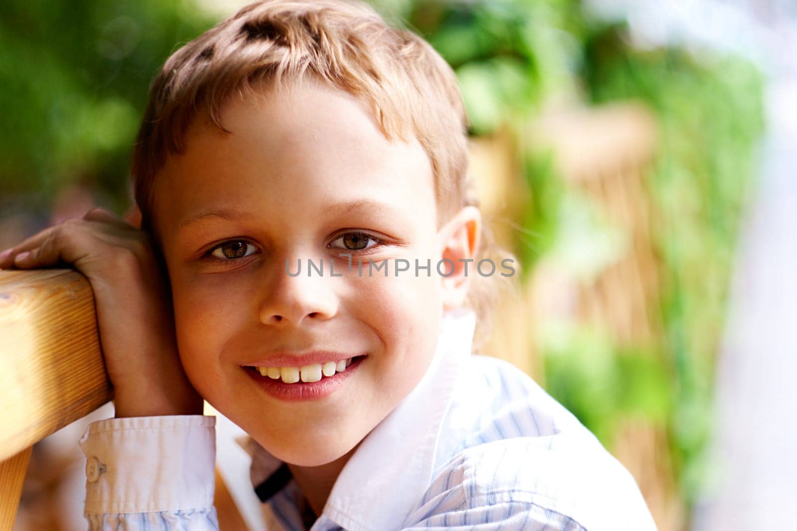 Portrait of happy kid looking at camera