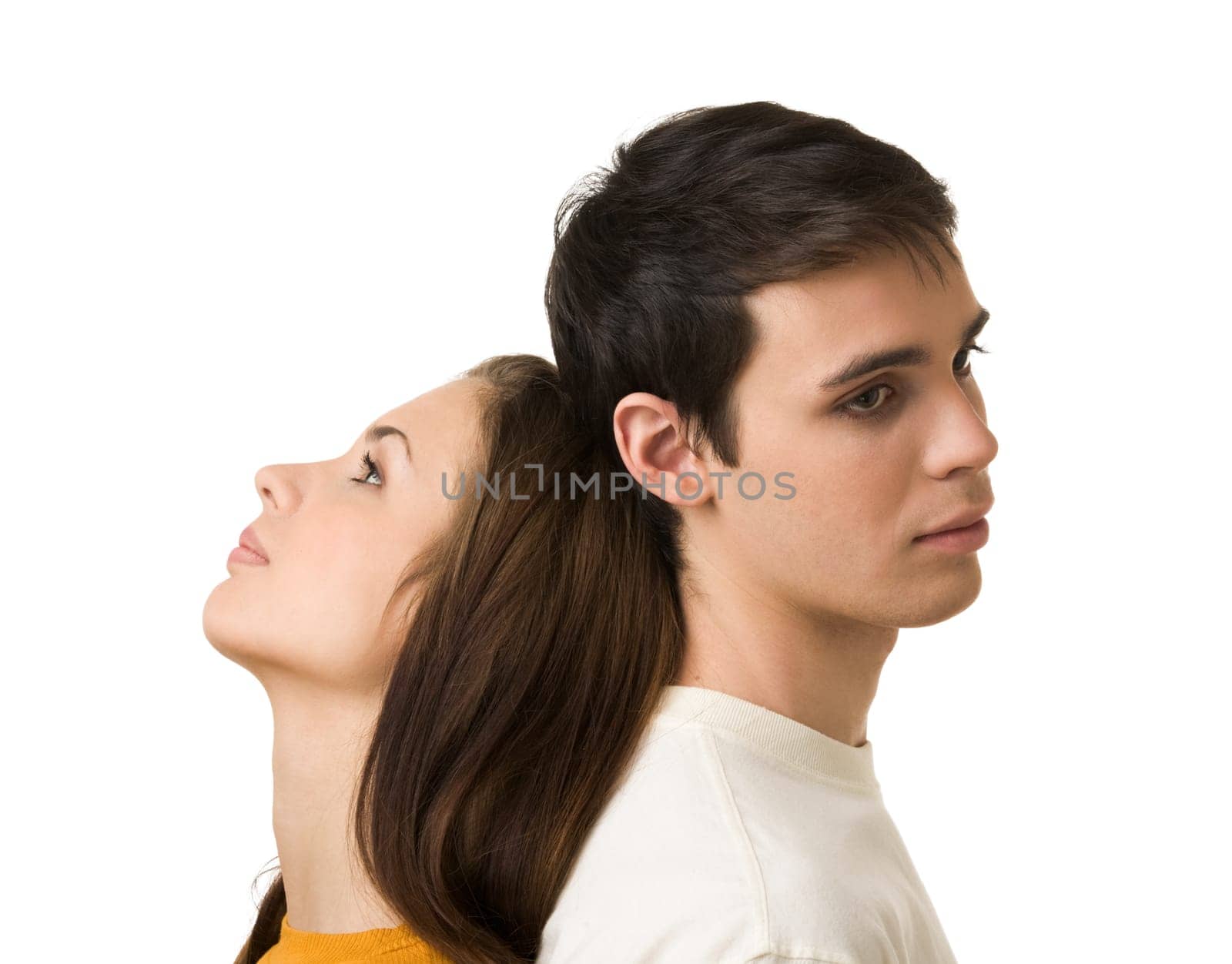 Photo of handsome guy and his girlfriend standing back to back