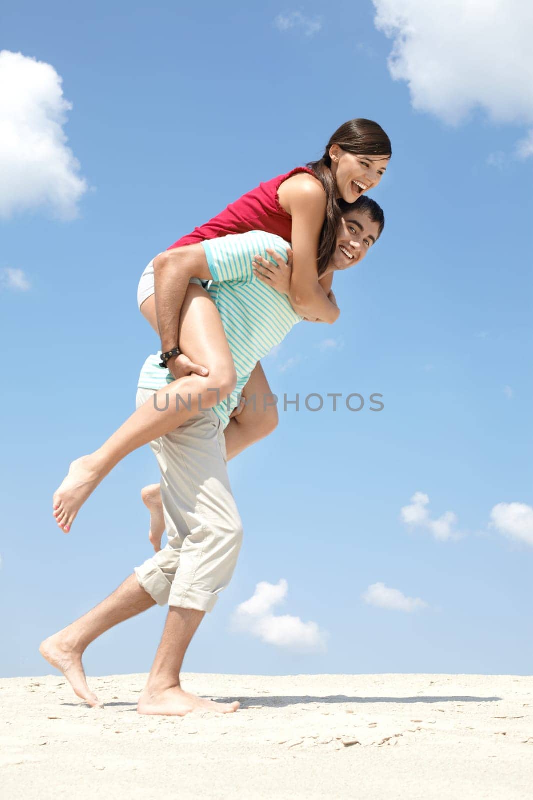 A young man carrying a woman on back