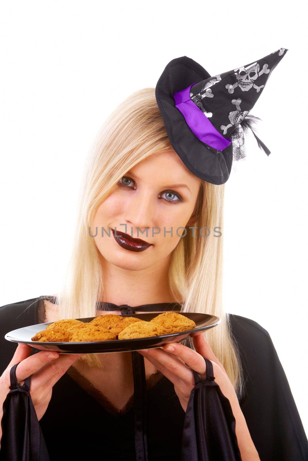 Image of witch with tray of biscuits on white background
