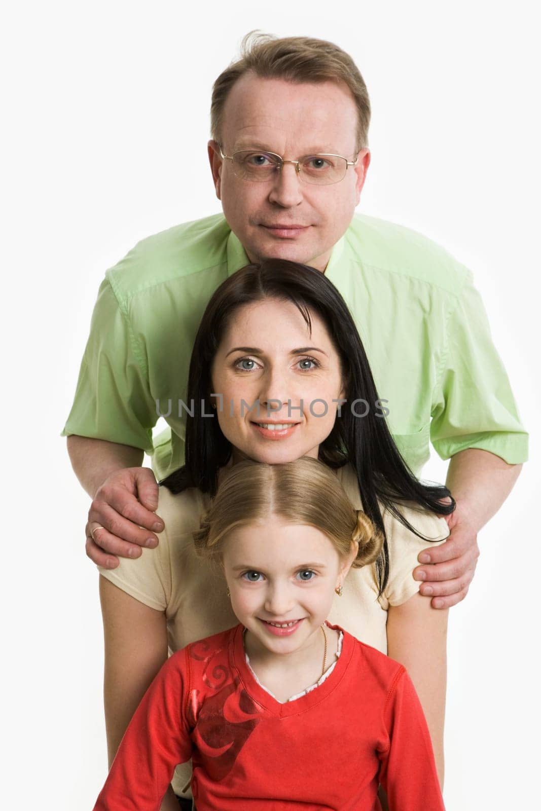 Image of family faces looking at camera and smiling on white background