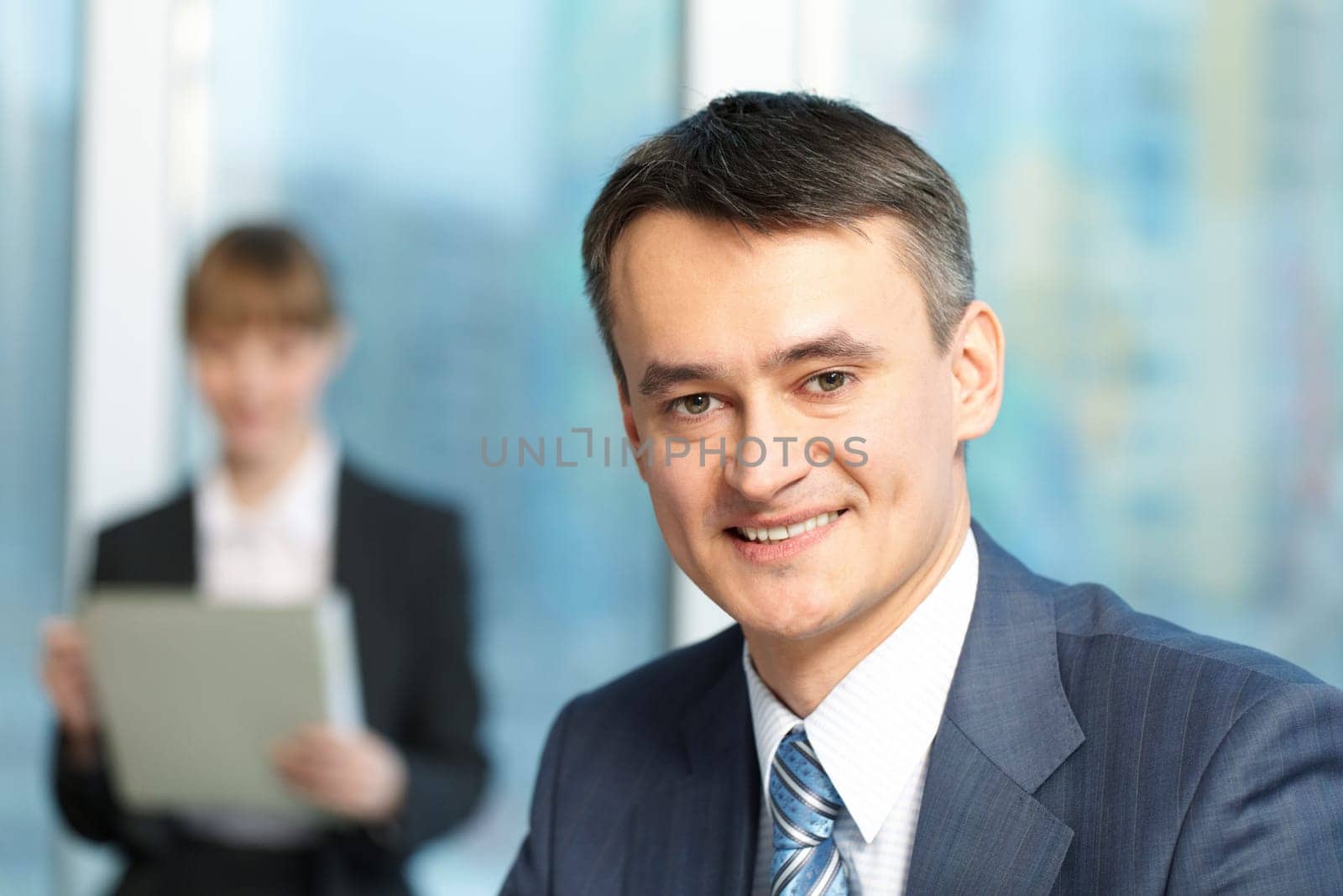 Close-up of mature smiling managers face