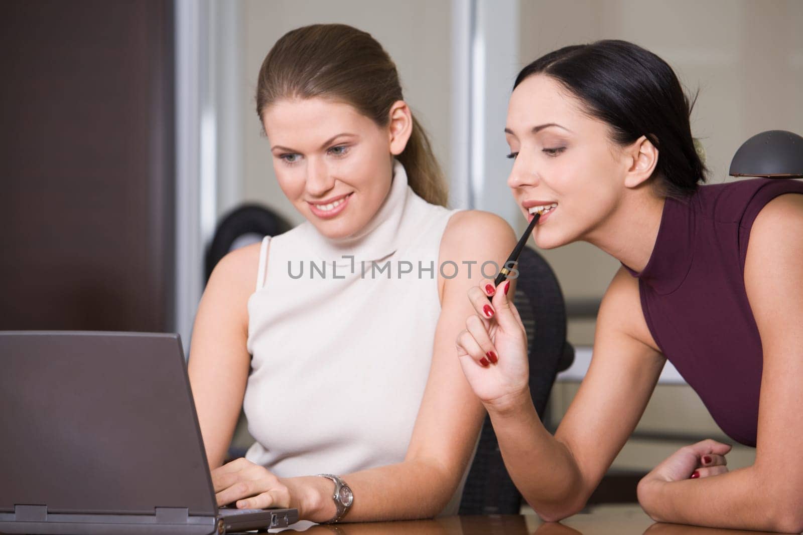 Beautiful girls are working on the computer
