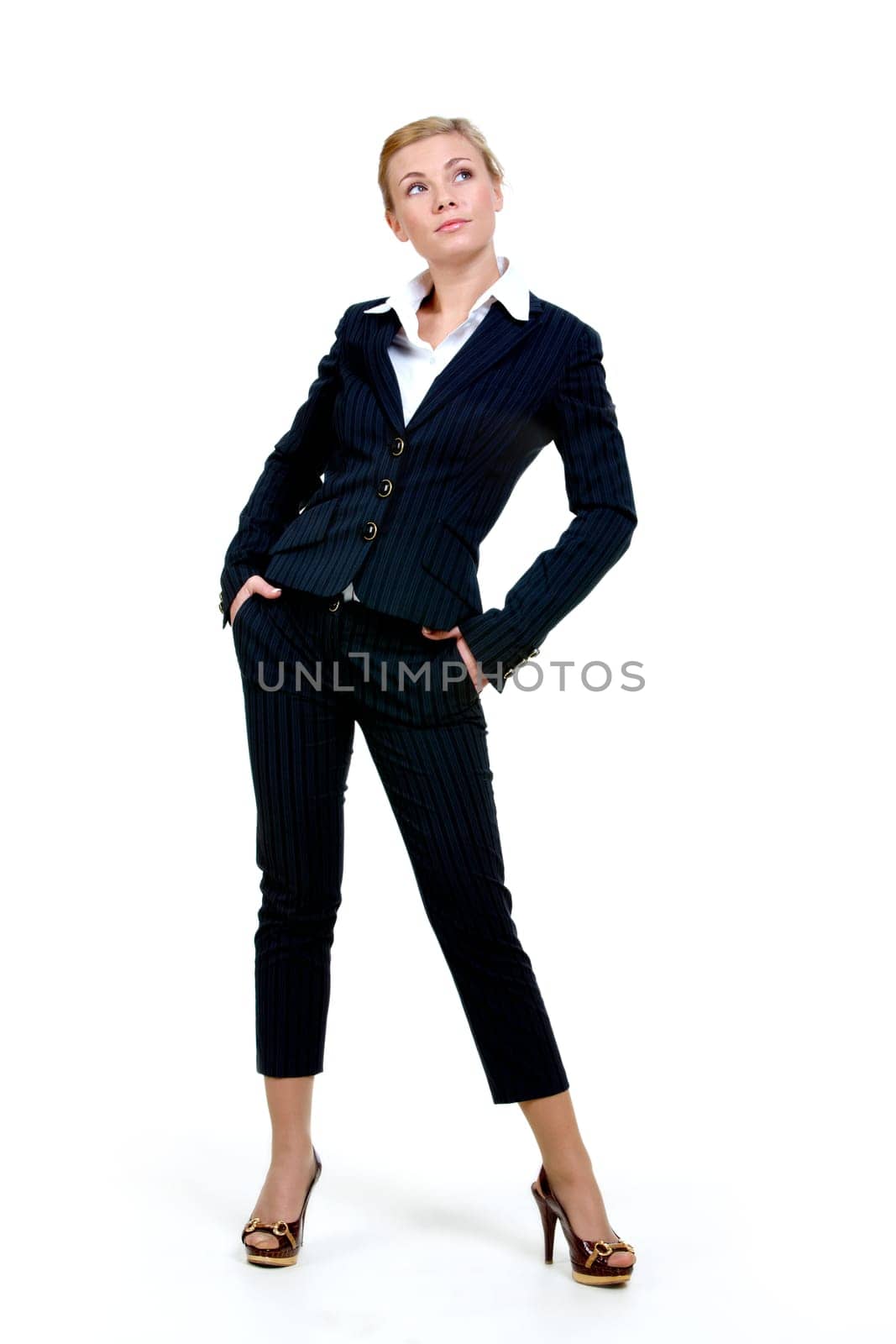 Portrait of elegant businesswoman in black suit on white background