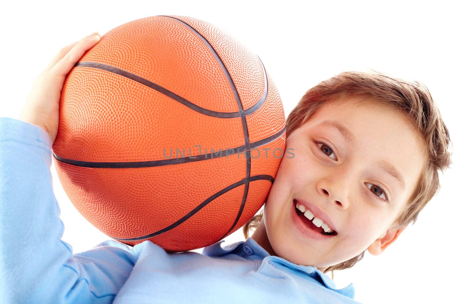 Portrait of a boy holding a basketball ball