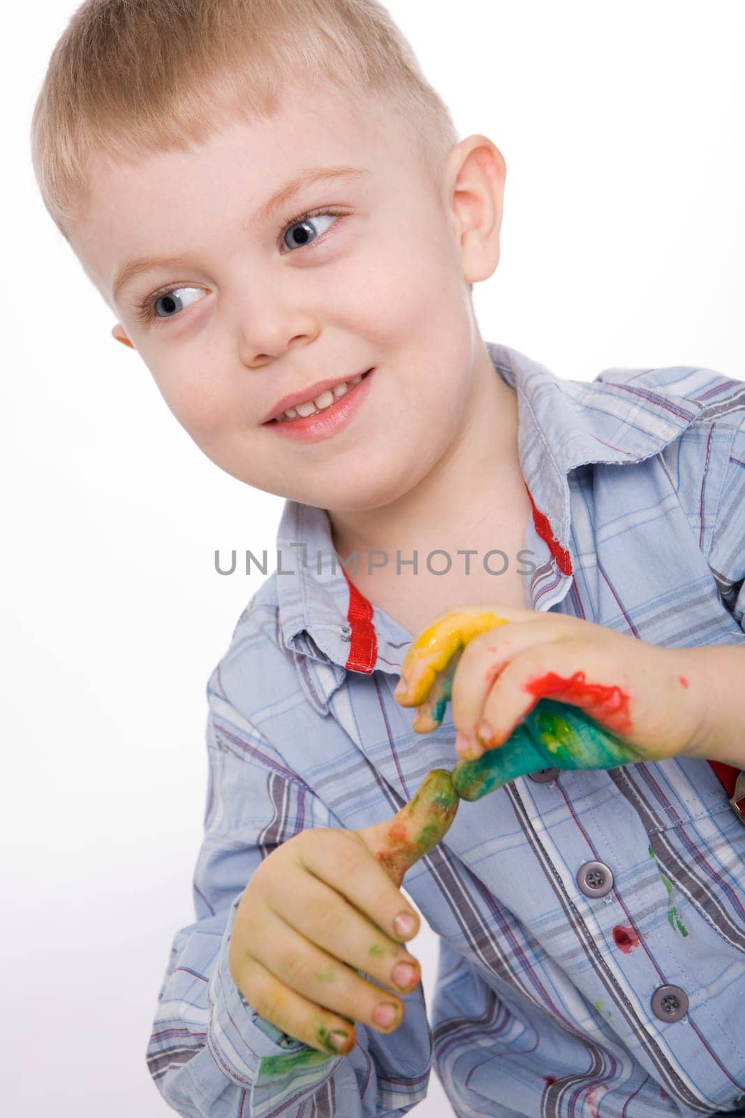 Image of preschooler with painted hands over white background