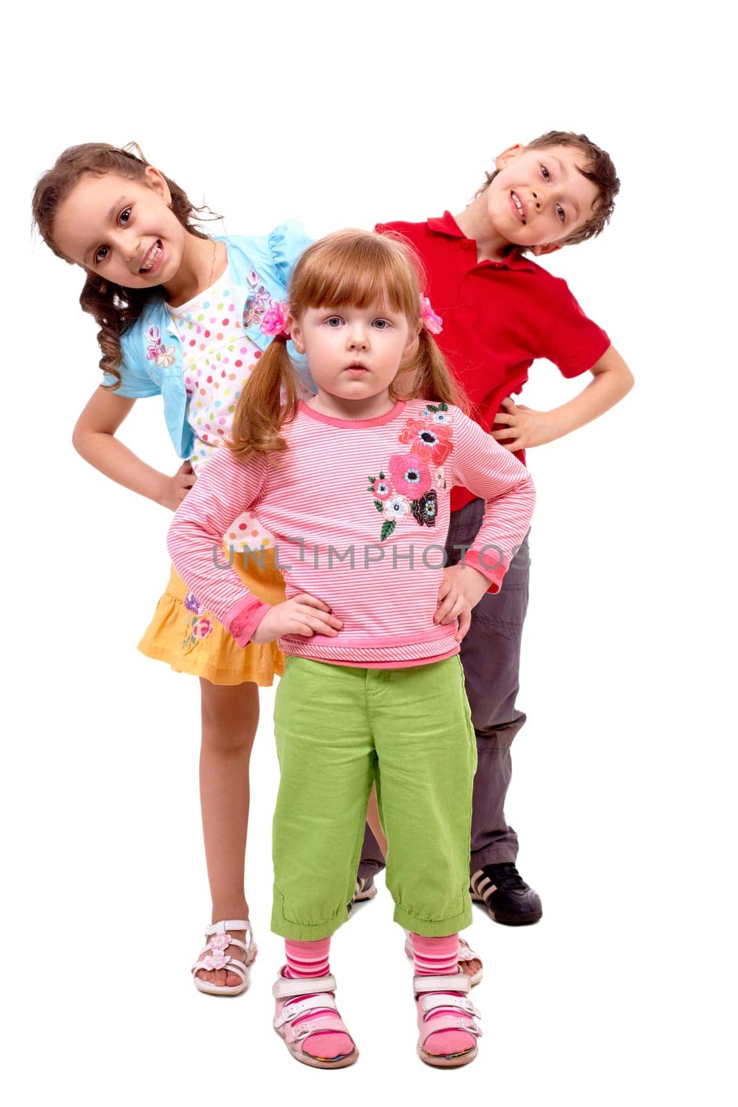 Portrait of smart girl standing before her happy friends over white background