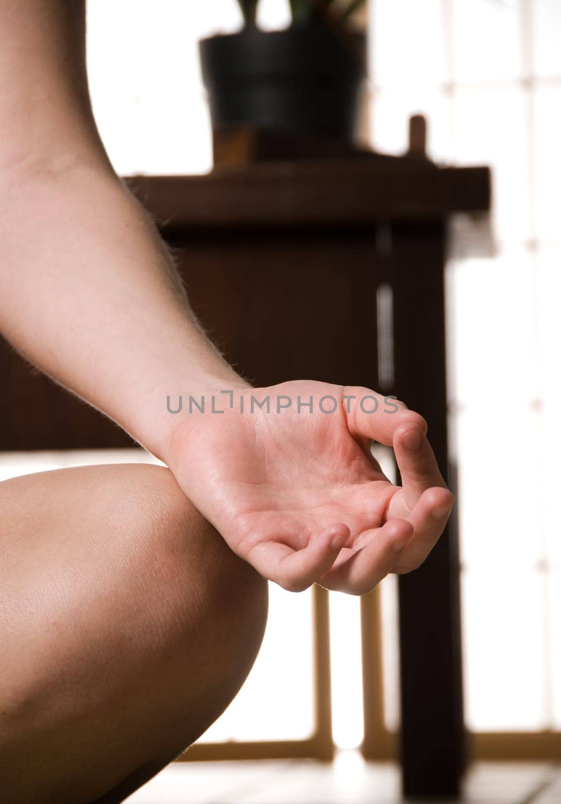 young blond woman meditating on the ground
