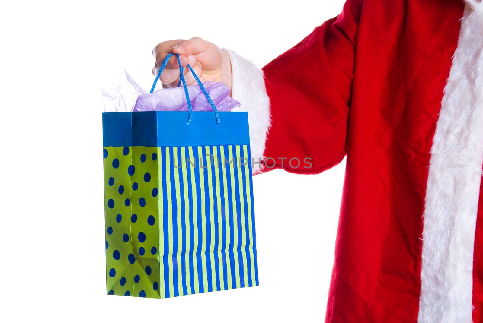 santa clause giving a ift in a bag