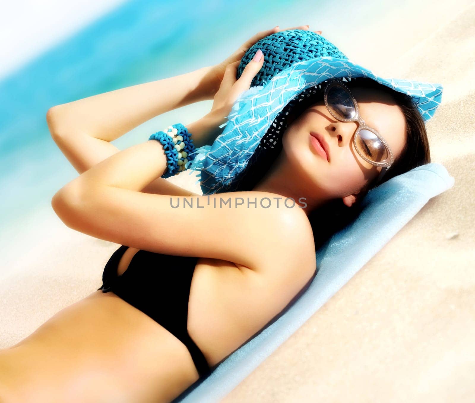 Portrait of a young girl lying in the sun