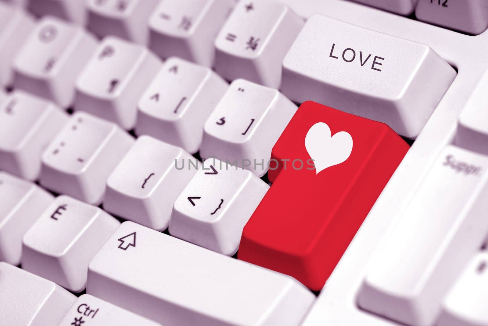 heart symbol on a red key of a keyboard