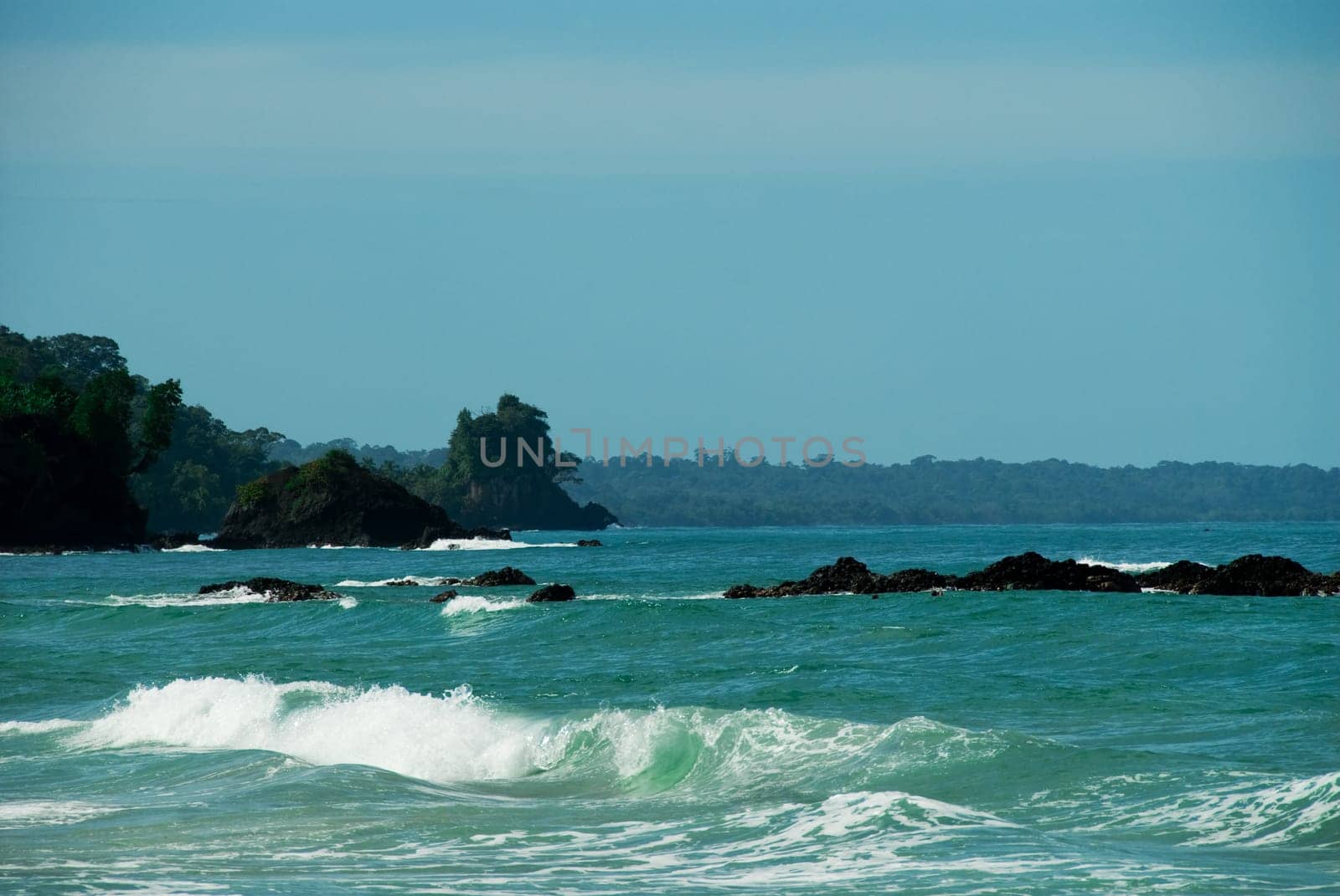 tropical beach in panama with some waves crashing